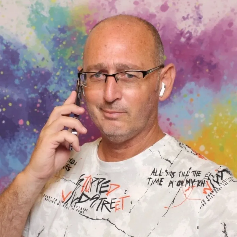 Ami Halfon speaking on the phone