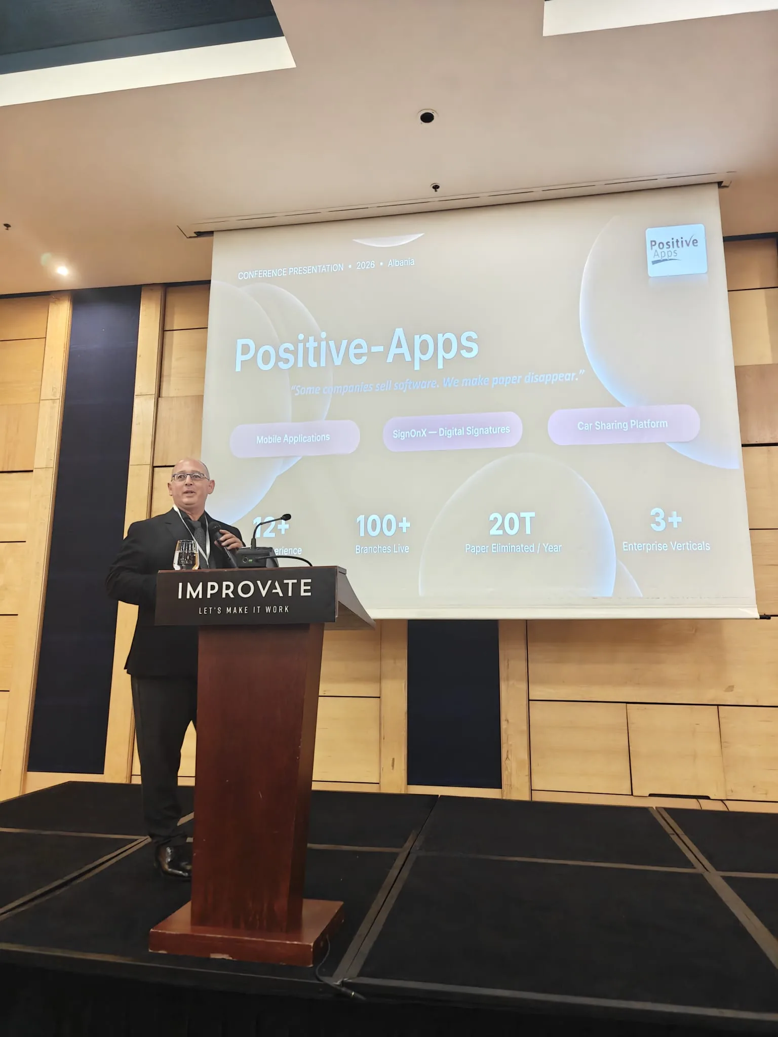 Ami Halfon presenting Positive-Apps at a conference in Albania